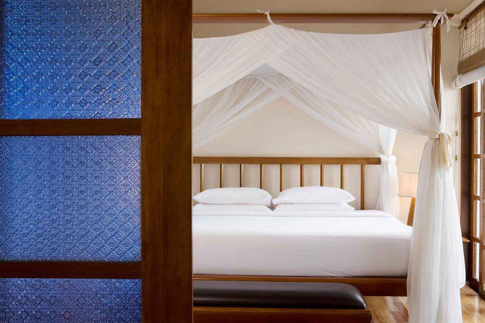 Avillion Port Dickson Hotel Exterior photo A bed with a mosquito net